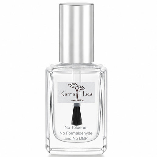 A clear glass bottle of KarmalHues fragrance with a reflective silver cap and a white label featuring a black brush and tree logo, set against a plain white background.